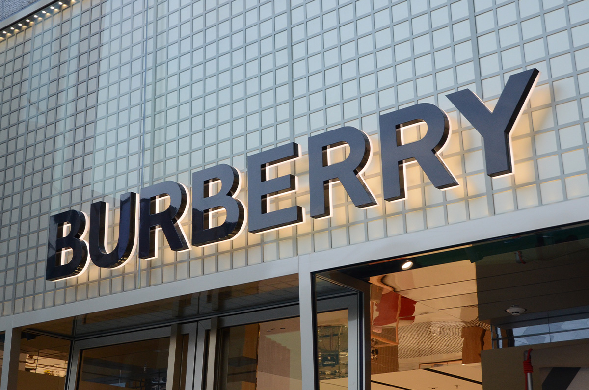 Custom backlit building facade signs read at scale